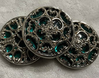 Large Green Faux Twinkle Buttons. Plastic with Faux Gems and Faux Silver. 1 1/2 Inch Each. Plastic Shank. Very Pretty.