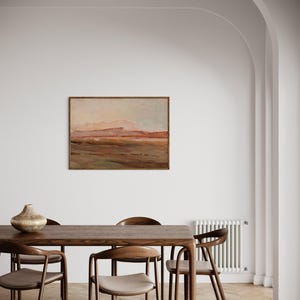 May include: A dining room scene featuring a rectangular wooden table with six matching chairs. A landscape painting hangs on the white wall above the table. A decorative vase sits on the table. The room has a neutral color palette.