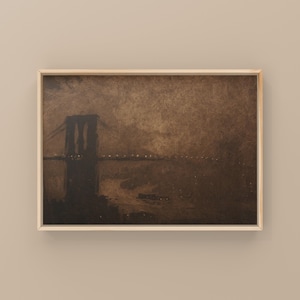 May include: A framed painting of a dark silhouette of a bridge against a brown, cloudy sky. The bridge is lit with small white lights.