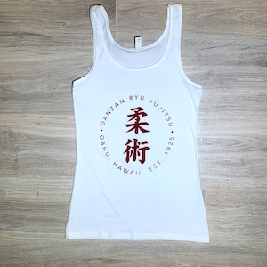 May include: White tank top with a red circle logo that says "Danzan Ryu Jujitsu, Oahu, Hawaii, Est. 1925" and has Japanese characters in the centre.