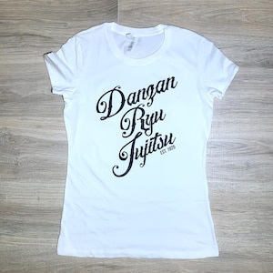 May include: White t-shirt with black text that reads "Dangan Ryu Jujitsu Est. 1925"