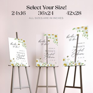 May include: Three bridal shower signs with daisy and bee graphics. The signs are on easels and display the text "Bride to bee!" and "Welcome to Melissa's Bridal Shower". Sizes available are 24x16, 36x24, and 42x28 inches.