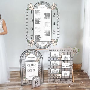 May include: Wedding seating chart and order of events signs with a stained glass design featuring magnolia flowers. The signs are on easels and have a black and white colour scheme. The seating chart lists guest names and table numbers. The order of events sign lists the times for the ceremony, first dance, toast to newlyweds, photo booth, dinner and cake cutting, and crazy hour. The signs also include the names Claire and Richie and the date May 17, 2025.