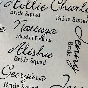 May include: A set of black vinyl stickers with names and titles for a wedding party. The names include Hollie, Nattaya, Alisha, Georgina, and Jenny. The titles include Bride Squad, Maid of Honour, and Bride.