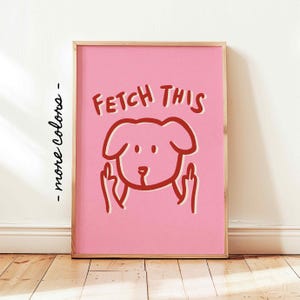 Könnte beinhalten: Rosa und rote Illustration eines Hundes, der den Mittelfinger zeigt, mit dem Text "FETCH THIS" auf rosa Hintergrund.