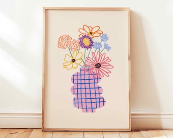 May include: A framed print of a colorful illustration of a bouquet of flowers in a pink and blue checkered vase.