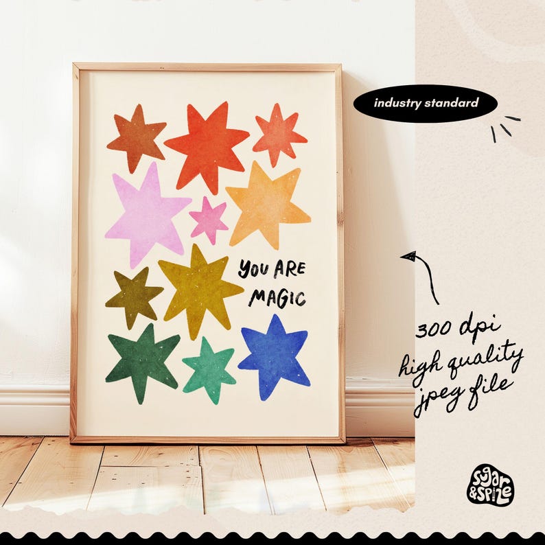 May include: A framed art print featuring colorful star illustrations in shades of orange, red, pink, yellow, green, and blue. The words "YOU ARE MAGIC" are written in black. The print is labeled "industry standard" and "300 dpi high quality jpeg file".