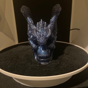 Blue skull with dragon on top