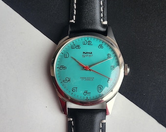Reloj vintage HMT Janata Tamil: esfera verde mar, correa de piel negra