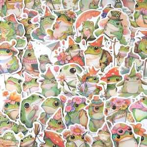Può includere: Una collezione di adesivi a forma di rana stravaganti in varie pose e abiti. Gli adesivi presentano rane con cappelli, fiori e altri accessori nelle tonalità del verde, bianco e rosa. Gli adesivi sono disposti vicini.