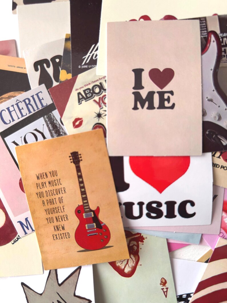 May include: A collection of vintage-style cards with various designs. One card reads "I ❤️ ME" in black text with a red heart. Another features a red guitar and the quote, "When you play music you discover a part of yourself you never knew existed."