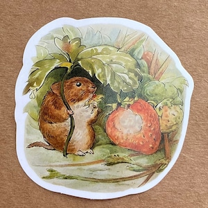 May include: A brown mouse with a long tail sits under a green leaf and eats a red strawberry. The mouse is holding a green stem in its paws.