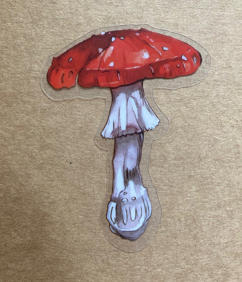 May include: A red and white mushroom sticker with white spots on the cap. The mushroom has a long, slender stem.