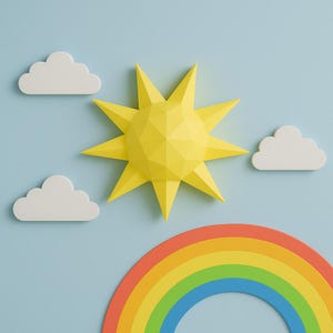 Puede incluir: Una escena caprichosa con un sol amarillo de papel, nubes blancas y un arcoíris sobre un fondo azul claro. El sol tiene un diseño geométrico. El arcoíris se encuentra en la parte inferior de la imagen.