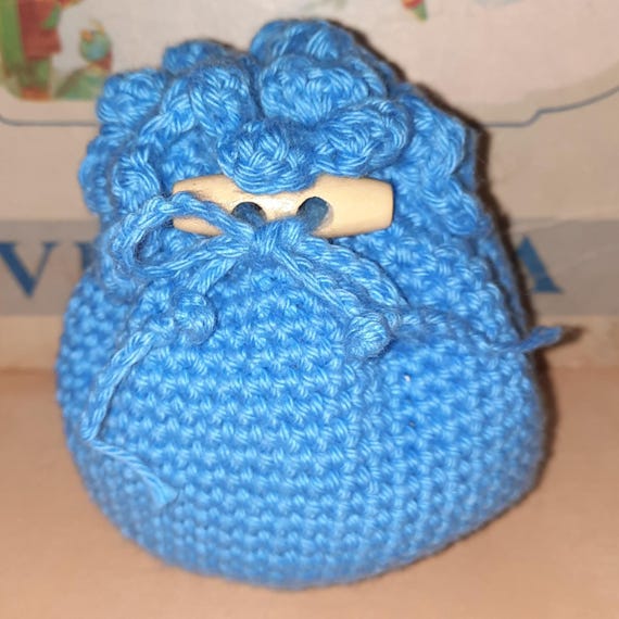Style and functionality come together in our handmade crochet money pouch
