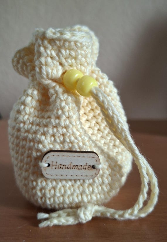 Style and functionality come together in our handmade crochet money pouch