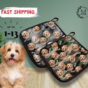 May include: Two black and white patterned pot holders with a dog's face repeated on the fabric. The pot holders have black trim and a loop for hanging. The dog's name "Ollie" is printed on the fabric.