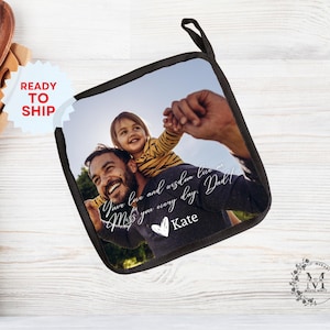 May include: A black and white photo of a father and child on a black pot holder. The text reads "Your love and wisdom live on. Miss you every day. Dad!" and "Kate".