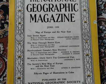 May include: A vintage June 1949 issue of The National Geographic Magazine. The cover is yellow with black and white text, including the magazine title, issue details, and article titles. The magazine is slightly worn.