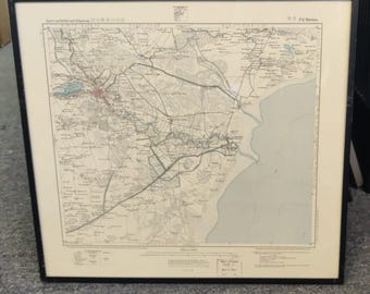 May include: Framed vintage map with Japanese text and detailed cartography. The map features a coastal region with roads, rivers, and towns. The frame is black, and the map is set against a cream-colored background.