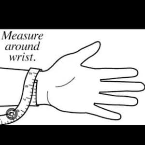 May include: A black and white illustration of a hand with a measuring tape wrapped around the wrist. The text "Measure around wrist." is above the hand.