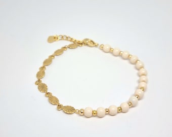 Bracelet made of cream-colored beads and stainless steel links with a sunray look