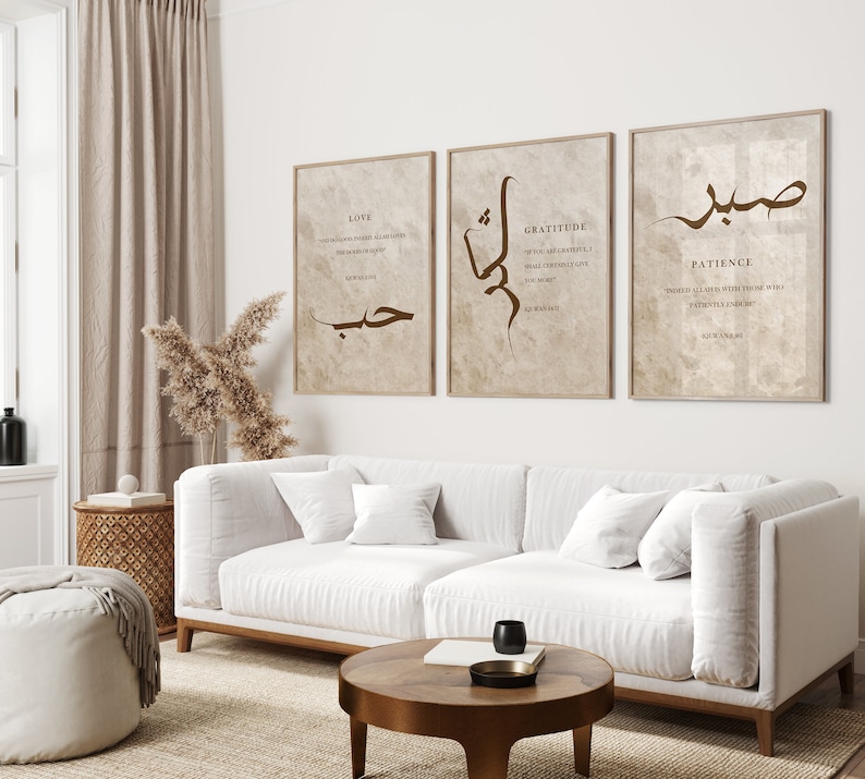 May include: Three beige framed prints with brown calligraphy and text. The prints feature the words "Love", "Gratitude", and "Patience" with Arabic calligraphy and English text.