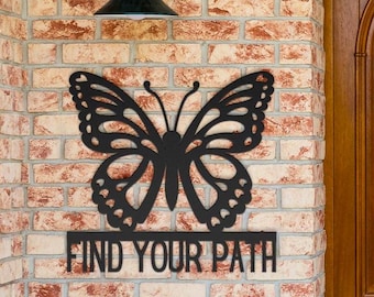 Letrero metálico con forma de mariposa "Encuentra tu camino"