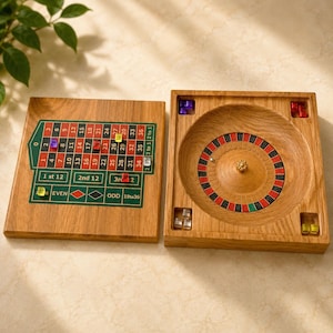 Small European roulette wheel and its wooden and epoxy resin casino mat