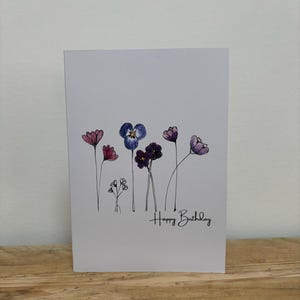 Eine Februar Blumen Geburtstagskarte für Sie gestaltet