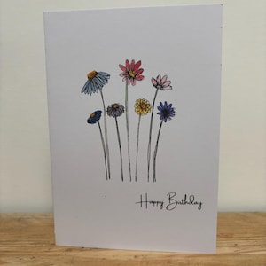 Una tarjeta de cumpleaños con flores de septiembre diseñada para ella.