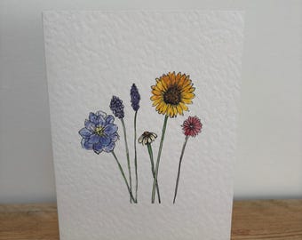 A July Flowers greeting card designed her, suitable for a July birthday or any occasion.