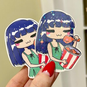 May include: Two cartoon stickers of girls with blue hair and green dresses. One girl is holding a bucket of fried chicken and the other is holding a single drumstick.