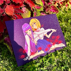 May include: A purple and yellow anime illustration of two girls with long hair, wearing school uniforms, standing in a field of red flowers. The background is a dark purple with glitter.