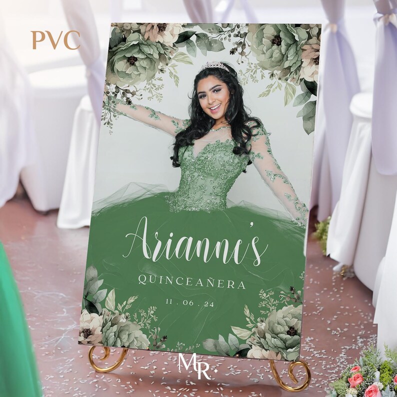 May include: A green and white floral backdrop with a photo of a young woman in a green dress. The text "Arianni's Quinceanera 11.06.24" is printed on the backdrop.