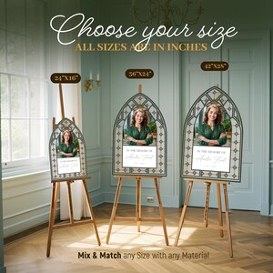 May include: Memorial sign with a photo of a woman in a green top, framed in a decorative arch. The sign is on a wooden easel. Text reads "In the memory of" and "Choose your size, all sizes are in inches."