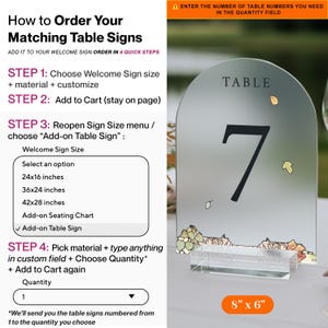 May include: An arched frosted acrylic table sign featuring the word TABLE and the number 7 in black, decorated with small autumn leaves. The sign is held by a clear rectangular base and measures 8 inches by 6 inches. Text instructions for ordering are provided on the left side.