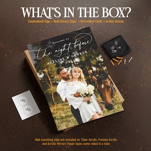 May include: A rectangular sign featuring a photograph of a couple and a horse, with the text "WELCOME TO the night before ADELINE & GEORGE". Included are wall mount clips, a microfiber cloth, and small extras in a cardboard box.