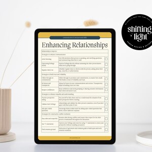 May include: A digital tablet displaying a checklist titled "Enhancing Relationships" with strategies to improve communication and build trust. The checklist includes items like active listening, expressing feelings, regular check-ins, and acknowledging perspectives.
