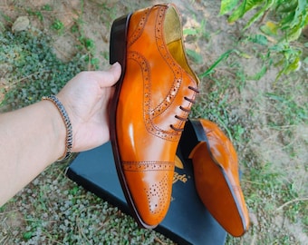 Handmade tan brown leather Oxford brogue shoes for men with classic lace-up formal design