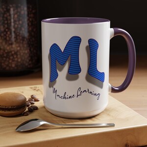 May include: White ceramic mug with a purple rim and handle. The mug features a blue and white striped graphic of the letters "ML" with the text "Machine Learning" below.