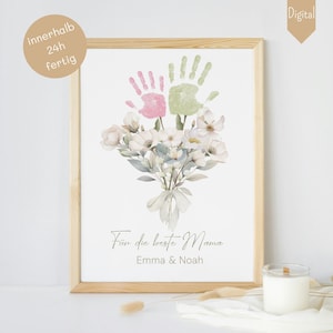 Peut inclure: Une impression numérique d'art imprimable avec deux empreintes de mains en rose et vert, un bouquet de fleurs blanches et le texte "Für die beste Mama Emma & Noah".