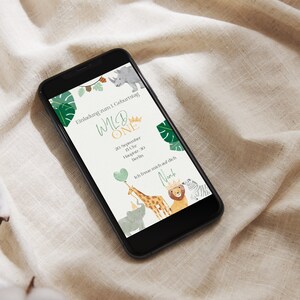 May include: A digital invitation for a first birthday party with a jungle theme. The invitation features a giraffe, lion, elephant, and rhino with the text "Wild One" and the date and time of the party.