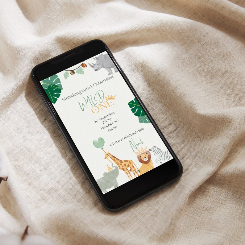 May include: A digital invitation for a first birthday party with a jungle theme. The invitation features a giraffe, lion, elephant, and rhino with the text "Wild One" and the date and time of the party.