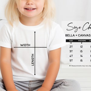 May include: Size chart for Bella + Canvas 3001T t-shirts, showing width and length measurements in inches for sizes 2T, 3T, 4T, and 5T.  Measurements may vary slightly.