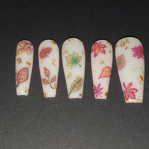 Frosted Matte Fall Leaf Nails with different fall colored leaves and gold foil flakes * Also Avail in &quot;Two Nails Shorter&quot; (IYKYK) Variations