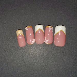 White and gold french tip press on nails with flower and pearl accent nails **Also Available in &quot;Two Nails Shorter&quot; (IYKYK) Variations**