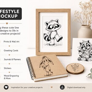 May include: A lifestyle mockup featuring a framed black and white raccoon print, a spiral-bound notebook with an Eeyore illustration, and a greeting card with a raccoon design. Additional items include a wooden coaster and a vase with dried flowers. The text reads "LIFESTYLE MOCKUP".