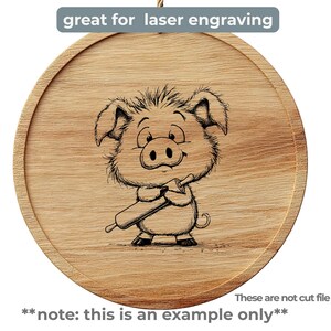 May include: A round wooden cutting board with a cartoon pig illustration holding a rolling pin. The text "great for laser engraving" is above the image. The text "note: this is an example only" is below the image.