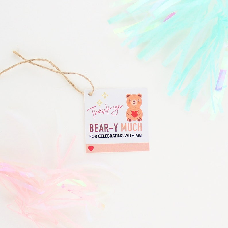 May include: A thank you tag with a brown bear holding a red heart. The tag says "Thank you BEAR-Y MUCH for celebrating with me!" with a small red heart at the bottom.